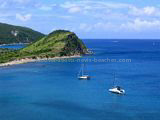 St Kitts Beaches - White House Bay showing two boats anchored in the bay and Guana Point in the background.