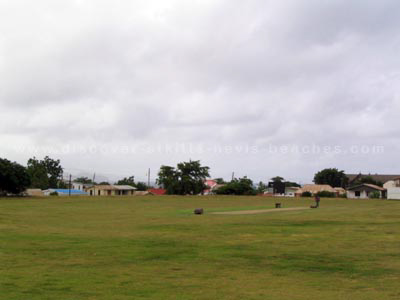 The old cricket pitch at Warner Park with the south eastern section in the background.  Today, the Carib Party Mound occupies the south eastern section of the Warner Park Cricket Grounds.