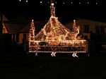 Photo of the Roundabout at Bakers Corner all lighted up.